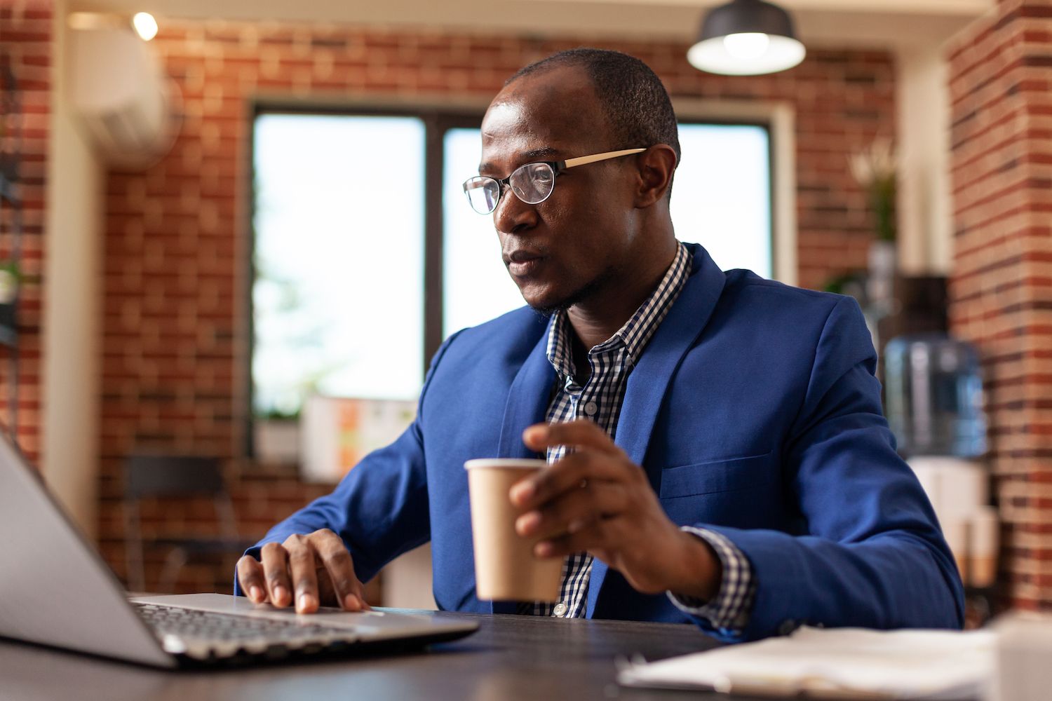 a woman  in a meeting with other co-workers discussing charts and graphs, representing market research.