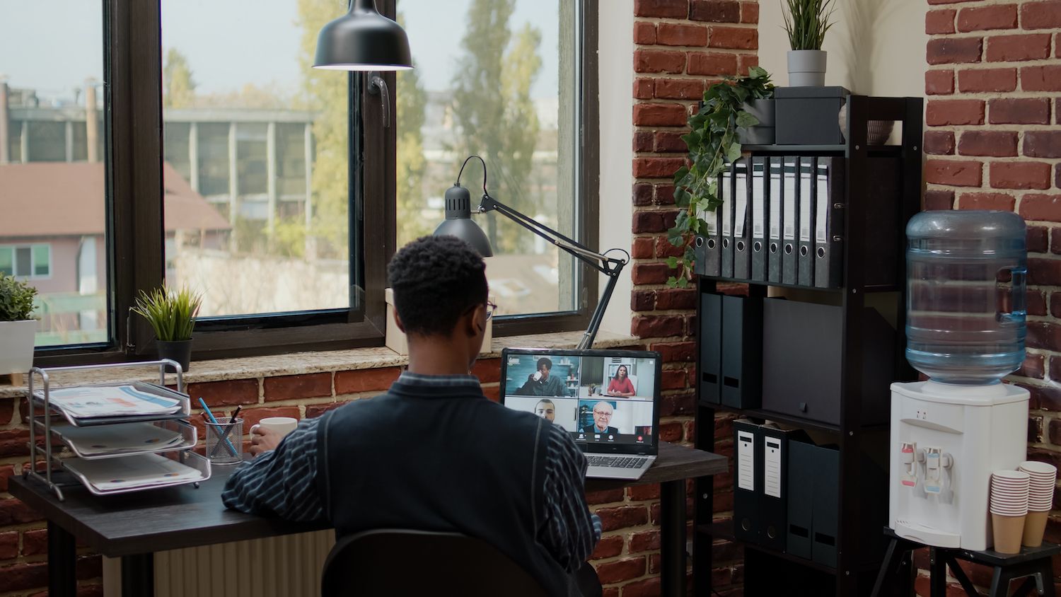 Man and woman looking over a laptop